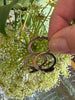 Close-up of vintage sterling silver ring with sculpted holding hands motif