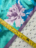 Measuring tape showing the vintage Liberty of London square silk scarf measures approximately 35x35 inches