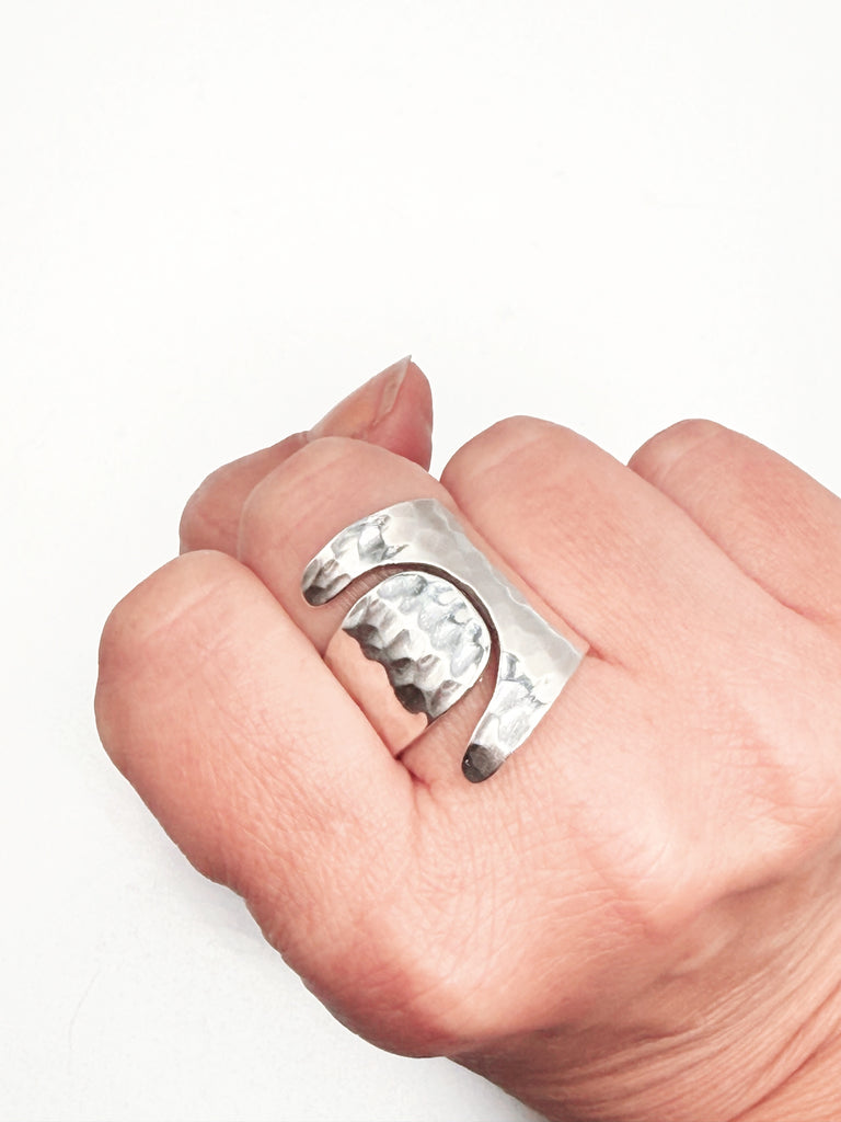 Chunky sterling silver statement ring worn on hand showing size and bold shape