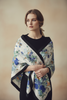 Large floral Western wild rag scarf styled around the shoulders. 