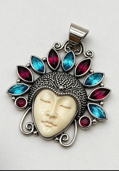 Vintage Balinese Moon Goddess 925 silver pendant with carved face and red and blue gemstone halo