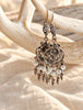 Sterling silver white bead filigree earrings hanging to show movement and detail
