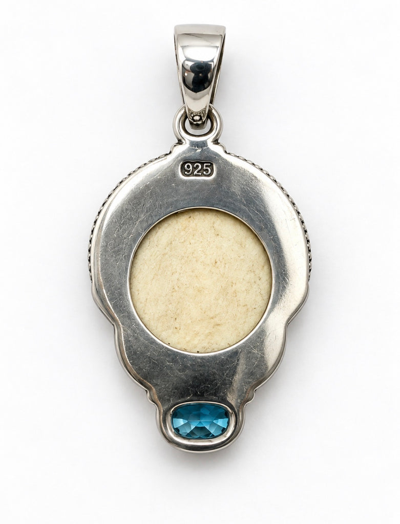 Back of vintage Balinese 925 silver pendant showing silver setting and decorative bail