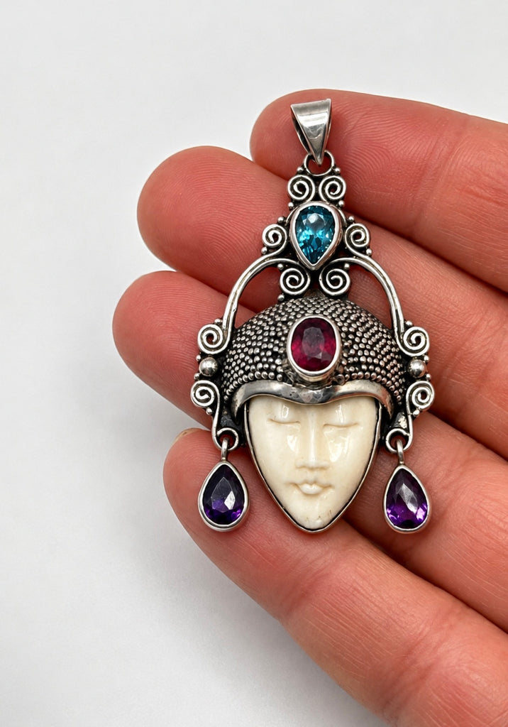 Vintage 925 sterling silver goddess pendant shown in hand with colourful gemstone details