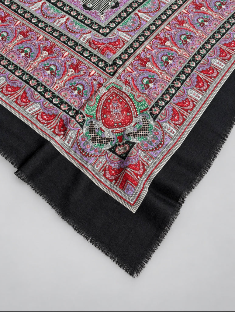 Close-up of ornamental paisley pattern and charcoal border on Italian scarf