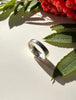 Back view of sterling silver opal ring showing wide band construction