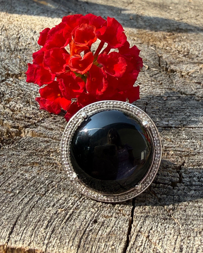 Vintage sterling silver ring with large round black onyx cabochon and double halo of clear stones