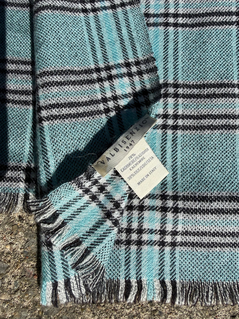 Close-up of Valbisenzio scarf label and fabric details
