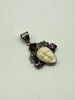 Vintage sterling silver goddess pendant with ornate Balinese scrollwork, carved cream face and colourful gemstones