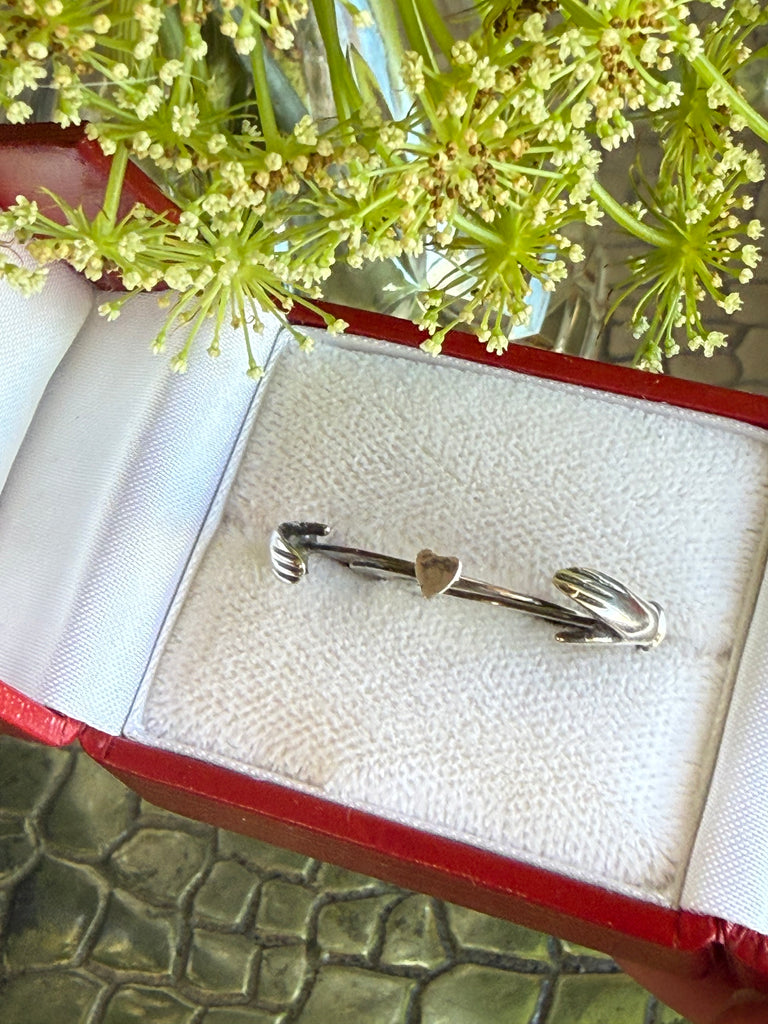 Close-up of vintage silver ring presented in jewellery gift box