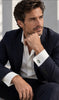 Man wearing formal suit styled with vintage silver cufflinks