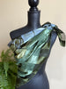 Large green Picasso art scarf styled around the shoulders on mannequin. 