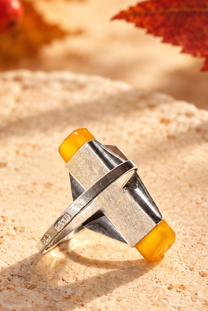 Close-up of butterscotch Baltic amber ring 