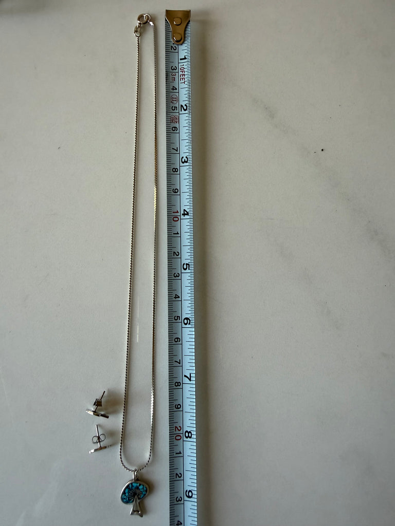 Vintage turquoise necklace shown beside measuring tape for length