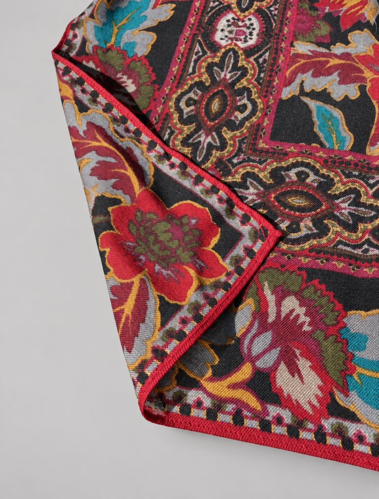 Close-up of richly coloured floral paisley scarf with ornate decorative border