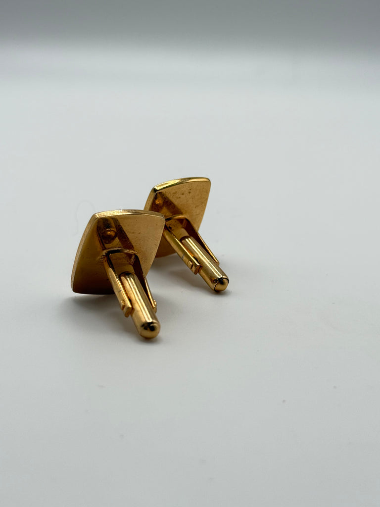 Back view of vintage green stone cufflinks showing gold-tone swivel closures