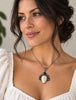 Vintage Balinese goddess pendant worn on a necklace showing its statement size