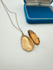 Vintage 1975 gold-filled photo locket shown open with two interior compartments