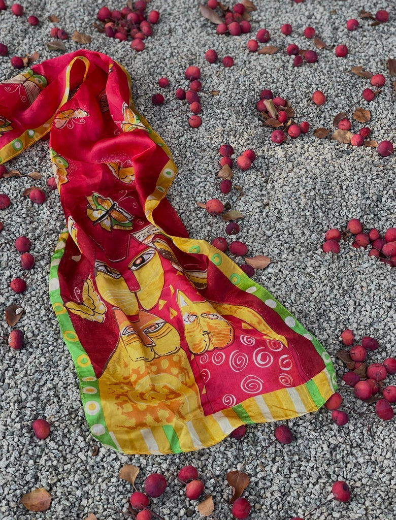 Close-up of colourful cats and butterflies printed on vintage silk scarf. 
