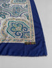 Close-up of ornate teal cream and blue paisley medallion pattern