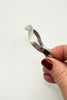 Vintage Mexican 925 sterling silver hinged bangle with sculptural squared shape shown in hand