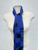 Vintage Echo cobalt blue geometric silk scarf styled long around mannequin neck. 