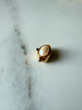 Front view of vintage gold-tone clasp with oval cream faux pearl