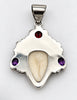 Back of vintage Balinese goddess pendant showing silver setting and large decorative bail