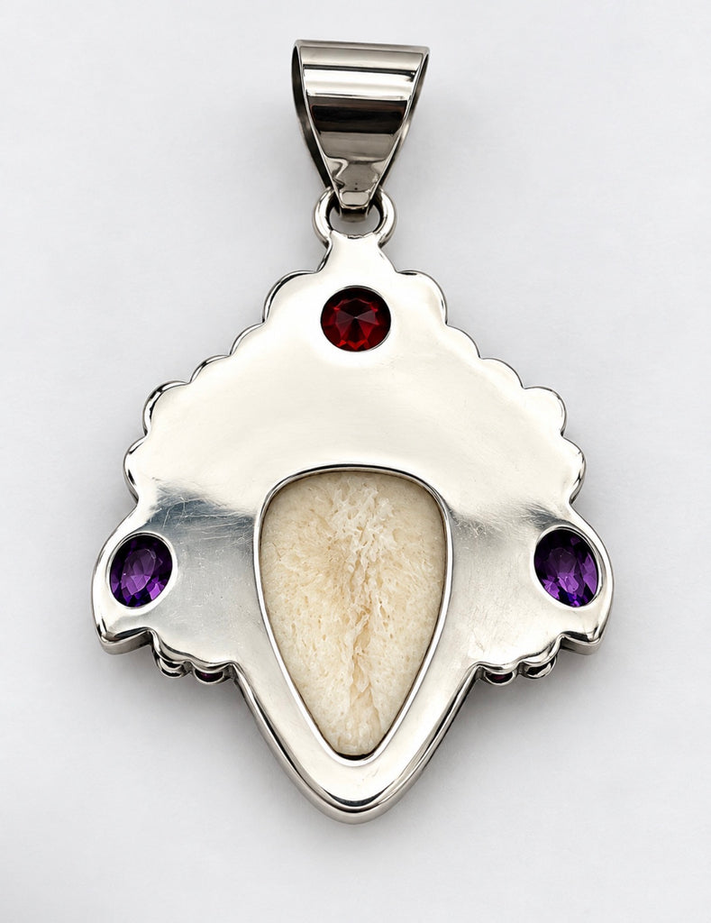 Back of vintage Balinese goddess pendant showing silver setting and large decorative bail