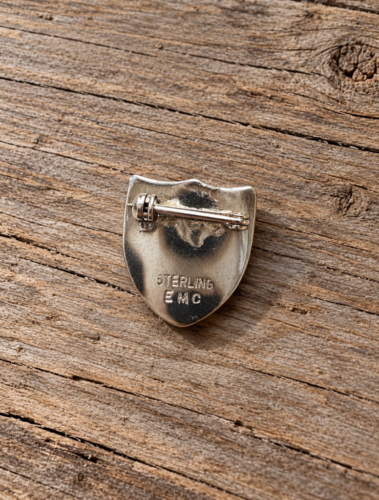 Back of vintage Banff sterling silver brooch showing STERLING EMC stamp and rollover clasp