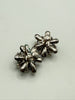 Back view of vintage flower earrings showing adjustable screw back closures