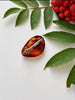 Back view of natural Baltic amber brooch showing pin-back closure