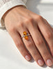 Scandinavian-inspired amber silver ring worn on hand showing minimalist design