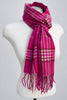 Pink and white plaid cashmere scarf wrapped around a white mannequin