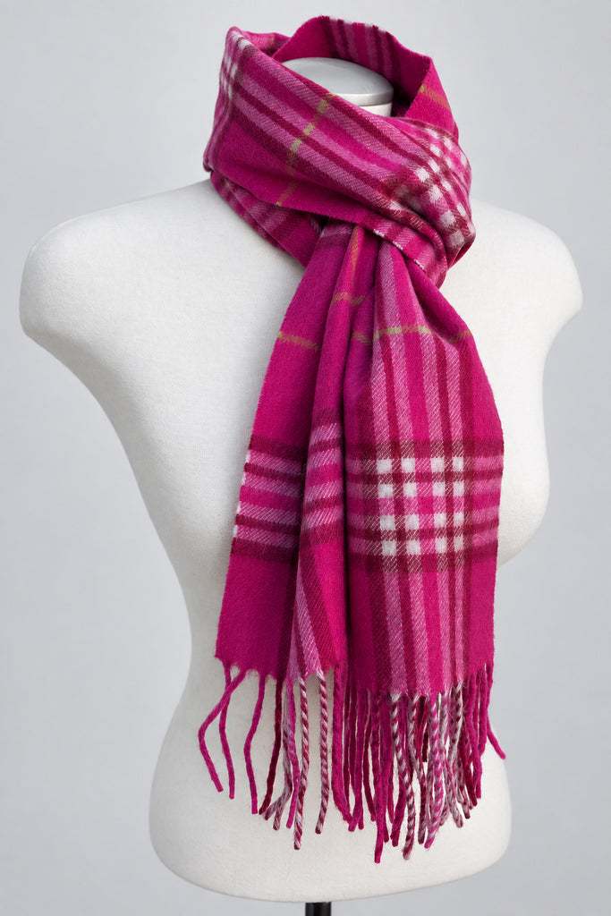 Pink and white plaid cashmere scarf wrapped around a white mannequin