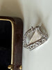 Irish harp marcasite brooch displayed beside open jewellery box