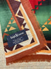 Close-up of vintage Ralph Lauren wool scarf showing Ralph Lauren label
