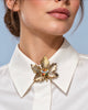 Vintage Canadian maple leaf brooch worn at collar of white blouse