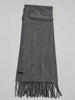 Charcoal grey cashmere scarf laid flat showing rectangular shape and fringed ends