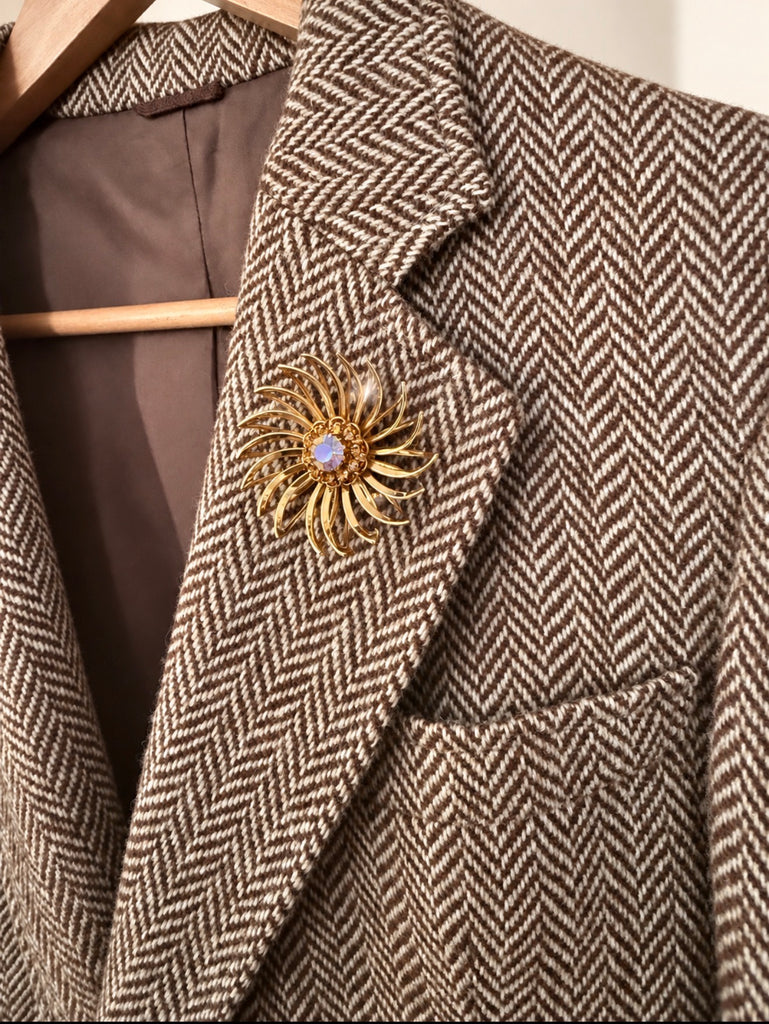 Vintage Sarah Coventry flower brooch worn on blazer lapel