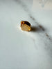 Back of vintage gold-tone jewellery clasp showing fold-over mechanism