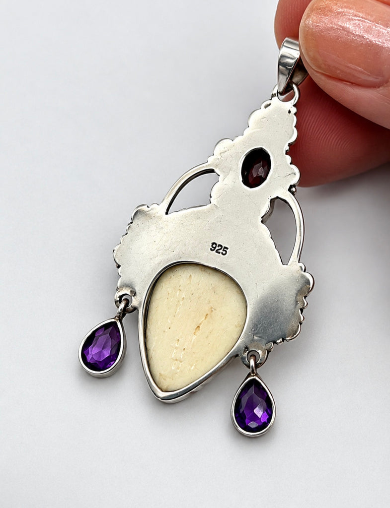 Back of vintage Balinese goddess 925 silver pendant showing silver setting and pendant bail