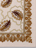 Close-up of caramel and chocolate brown decorative border on vintage wool scarf