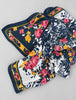 Vintage floral silk scarf folded to show navy border and colourful flowers