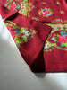 Close-up of vintage wool scarf showing pink blue and green floral print
