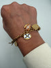 Vintage Canadian provincial enamel charm bracelet shown worn on wrist