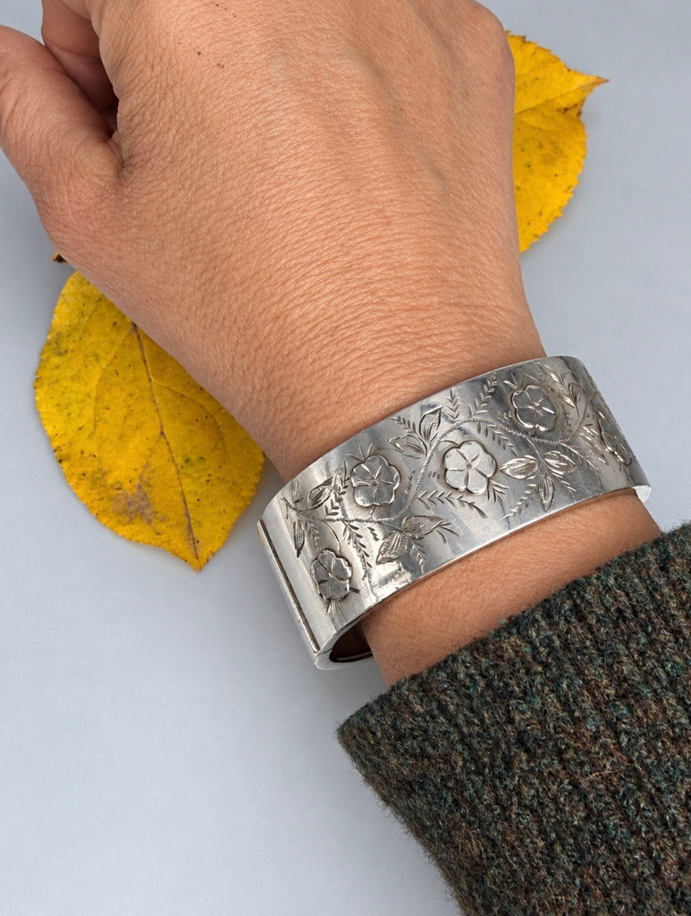 Antique Edwardian sterling silver bangle bracelet worn on wrist