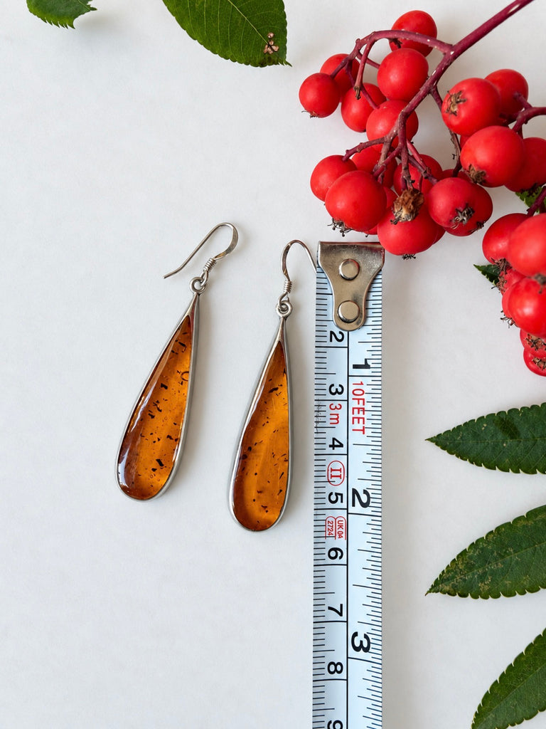1. Vintage honey-brown amber teardrop earrings measuring approximately 2 inches in length