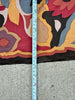 A close-up with a tape measure standing vertically to show the fabric width of 33 inches. 