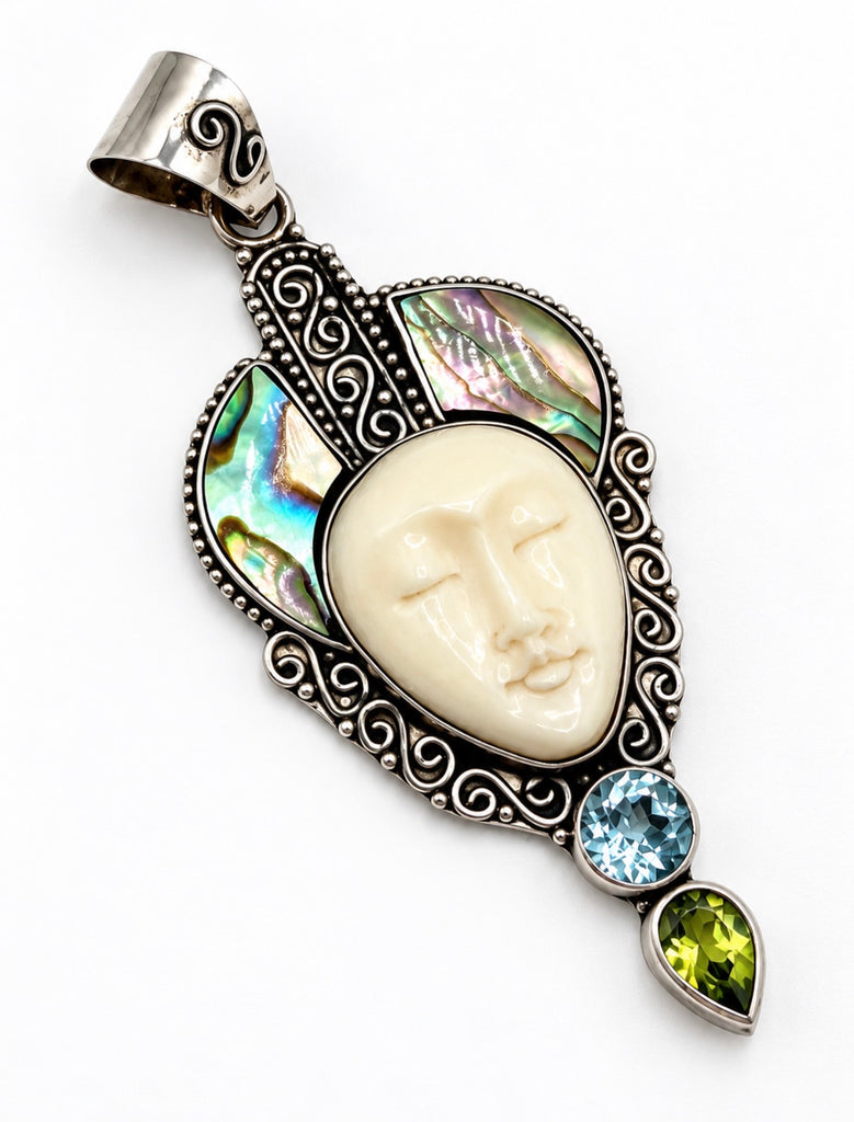 Vintage Bali 925 silver pendant with carved female face, abalone shell and blue green stone accents
